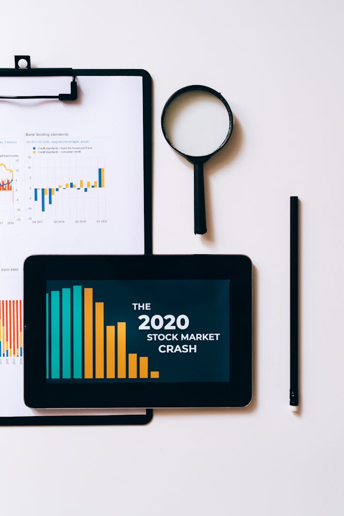 Clipboard with Statistical Data and Digital Tablet with Stock Market Display on Screen